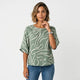 Blusa fluida de escote barco