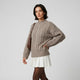Jersey de punto trenzado | cuello alto estructurado | aporta abrigo y presencia equilibrada