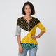 Blusa combinada | paneles geométricos con lunares | aporta amplitud cómoda y presencia visual