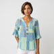 Blusa fluida de manga con volante