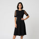 Vestido midi evasé con mangas semitransparentes | ligereza visual y caída elegante