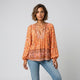 Blusa fluida de escote con lazada