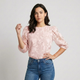 Blusa semitransparente con relieve floral | manga abullonada estructurada | elegancia ligera con presencia cuidada