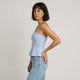 Top bandeau entallado con peplum